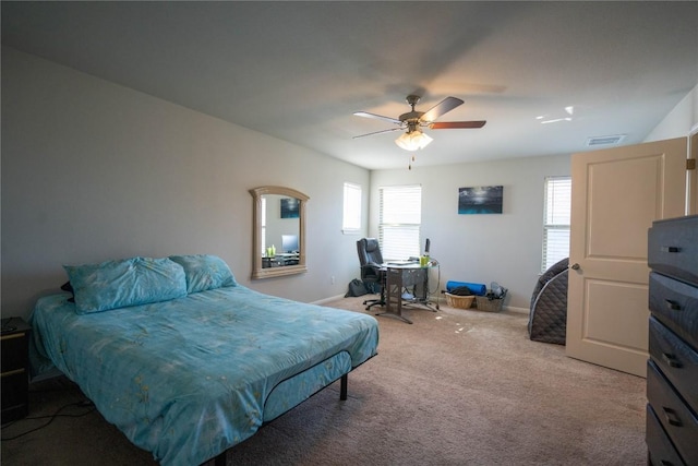 bedroom with light carpet and ceiling fan