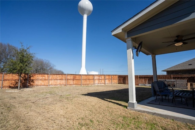 view of yard featuring a patio and ceiling fan