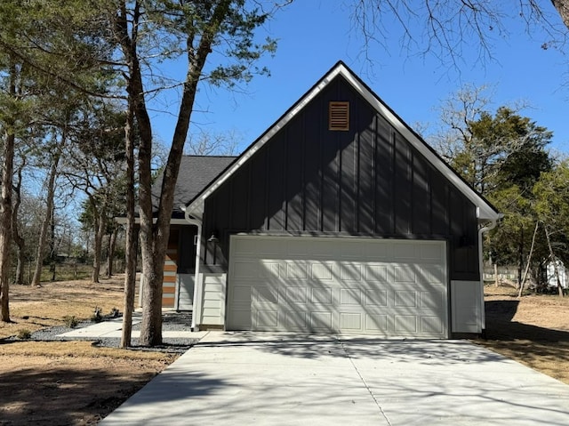240 Shadow Oak Dr, Bastrop, TX 78602 - view of front of property with driveway, board and batten siding, and an attached garage