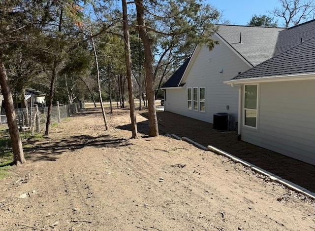 view of yard with central AC