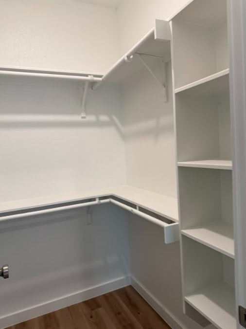 240 Shadow Oak Dr, Bastrop, TX 78602 - spacious closet with dark wood-style floors