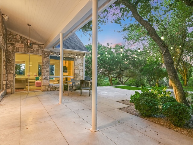 view of patio terrace at dusk