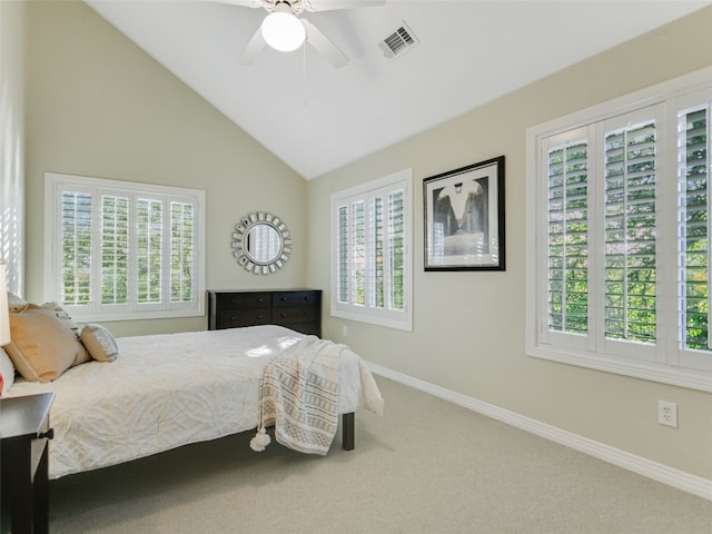 carpeted bedroom featuring vaulted ceiling, visible vents, baseboards, and ceiling fan