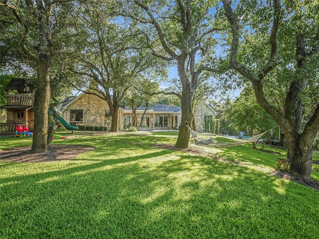 417 Beardsley Ln, Austin, TX 78746 - view of grassy yard with a playground