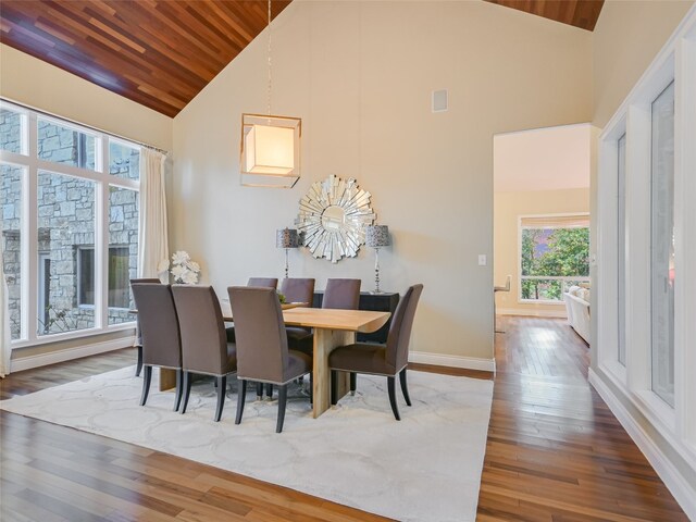 417 Beardsley Ln, Austin, TX 78746 - dining area with high vaulted ceiling, wooden ceiling, and wood finished floors