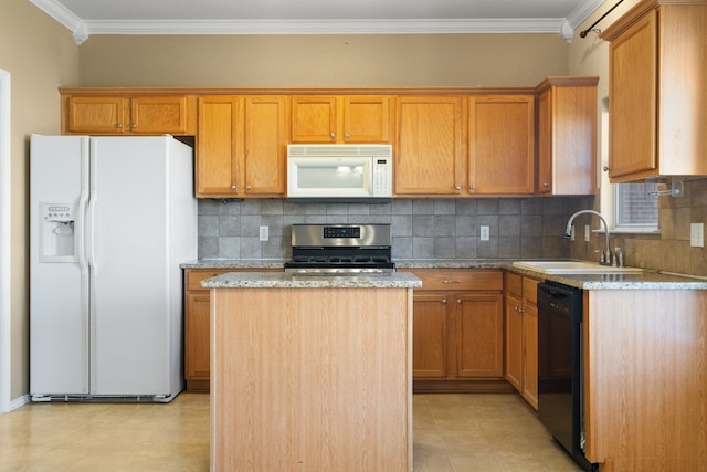 kitchen featuring white appliances, light stone counters, a kitchen island, ornamental molding, and a sink