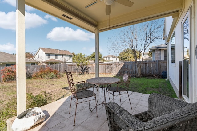 view of patio featuring ceiling fan