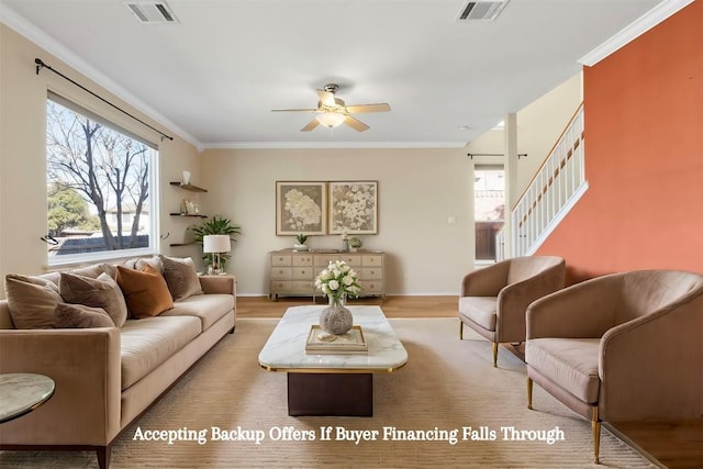 living room featuring stairs, wood finished floors, visible vents, and ornamental molding