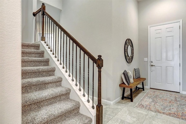 entryway with light tile patterned floors