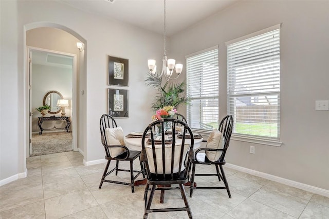 dining space featuring a chandelier and light tile patterned floors