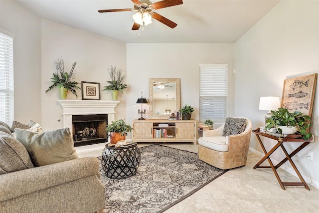 tiled living room featuring ceiling fan