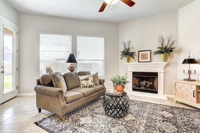 living room featuring light tile patterned floors, a healthy amount of sunlight, and ceiling fan