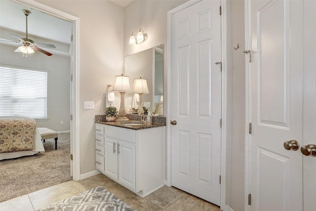 bathroom with ceiling fan, tile patterned floors, and vanity