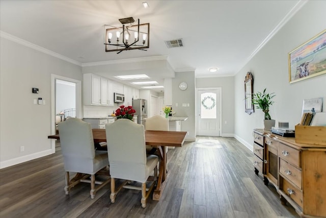 dining room featuring ornamental molding, a notable chandelier, and dark hardwood / wood-style flooring