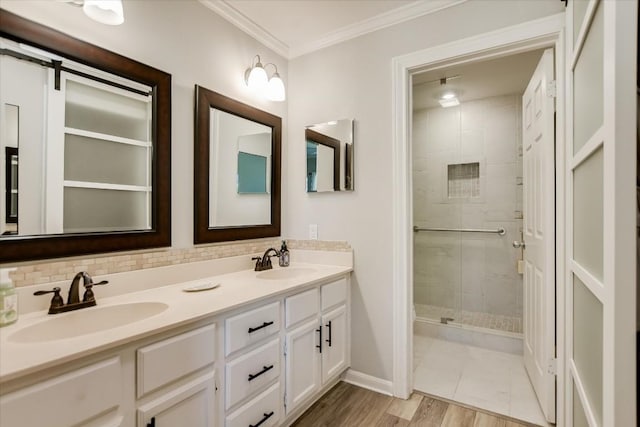 bathroom with tasteful backsplash, crown molding, vanity, and walk in shower