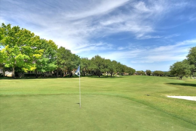 view of property's community featuring a lawn