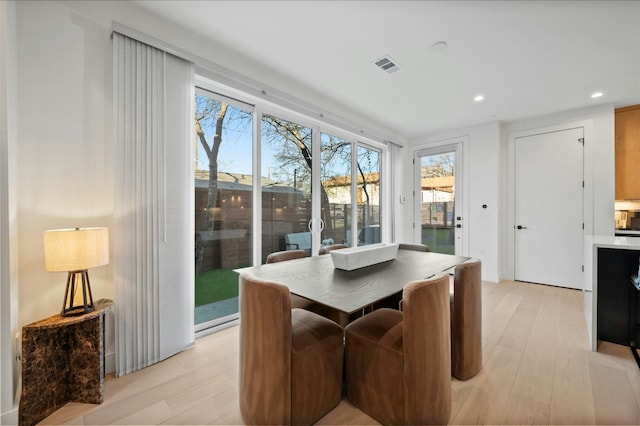 dining space featuring light hardwood / wood-style flooring