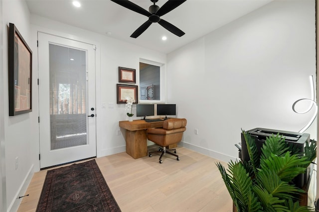 home office with ceiling fan and light wood-type flooring