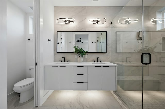 bathroom featuring an enclosed shower, vanity, and toilet