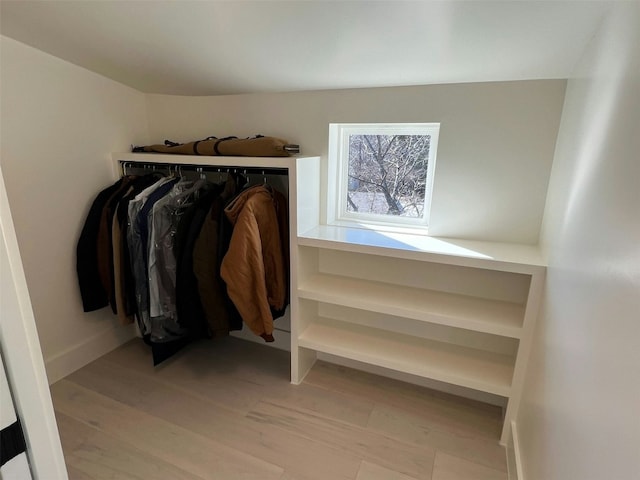 spacious closet featuring light hardwood / wood-style floors