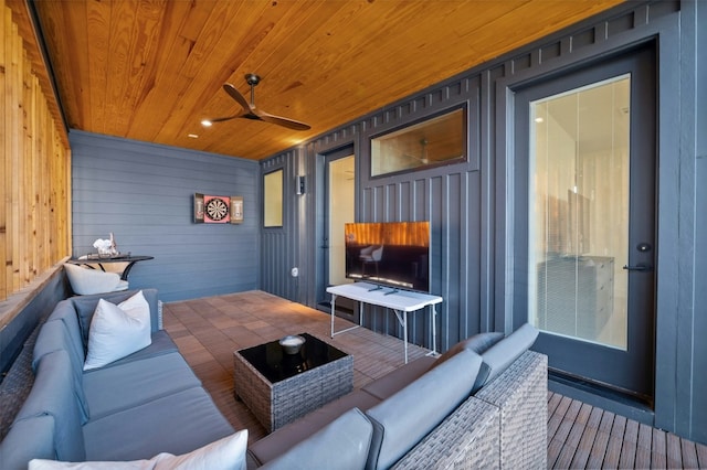 living room with ceiling fan and wooden ceiling