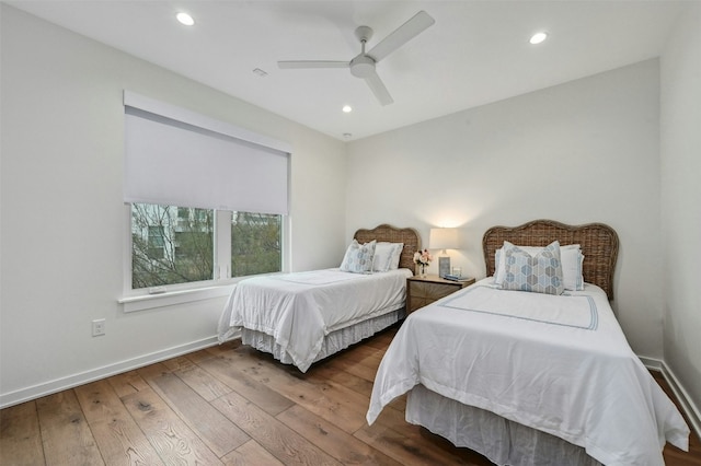 bedroom with ceiling fan and hardwood / wood-style floors