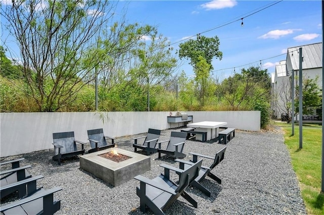 view of patio / terrace with a fire pit