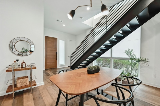 dining room with light hardwood / wood-style flooring