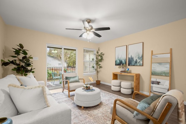 living room featuring hardwood / wood-style flooring and ceiling fan