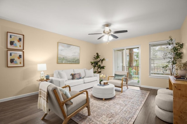 living room with dark hardwood / wood-style floors and ceiling fan