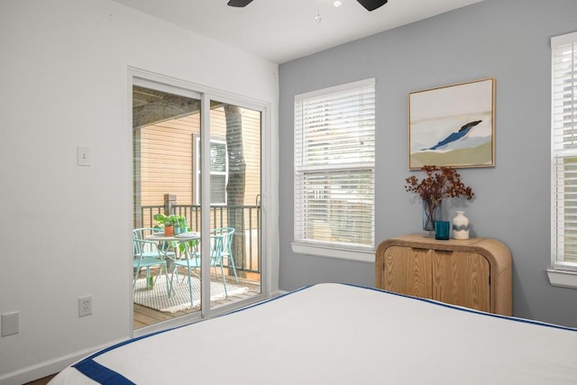 bedroom with access to exterior and ceiling fan