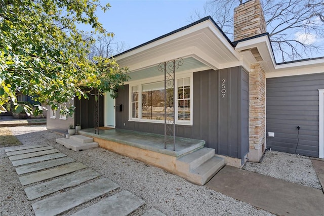 view of exterior entry with covered porch