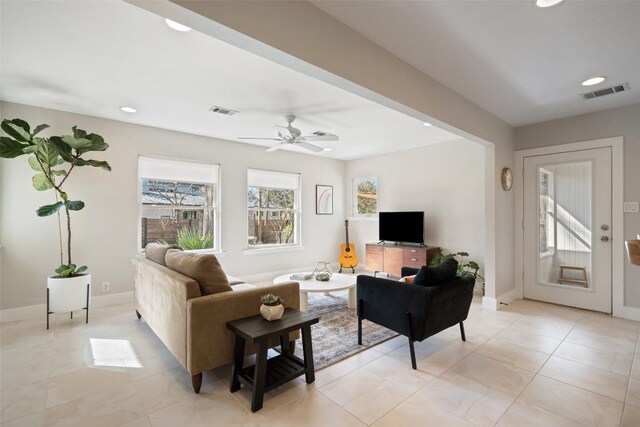 tiled living room with ceiling fan