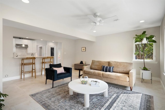 living room with ceiling fan