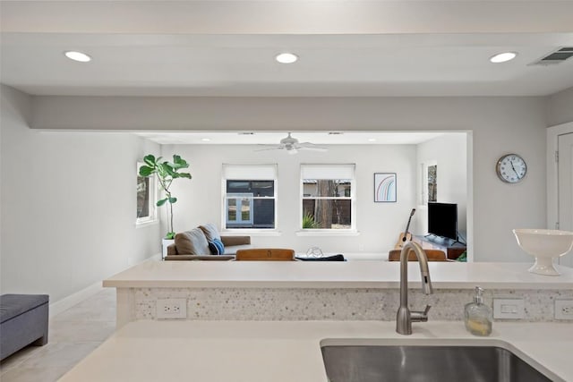 kitchen with ceiling fan and sink