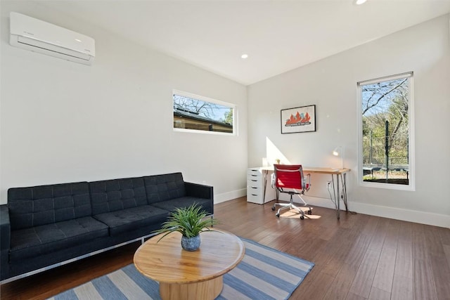 living room with dark hardwood / wood-style floors and an AC wall unit