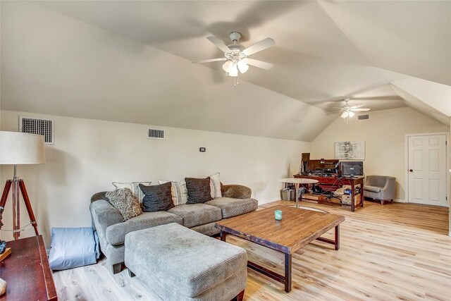 living room featuring vaulted ceiling, ceiling fan, and light wood-type flooring