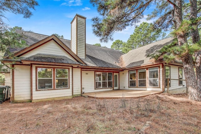 rear view of property featuring a patio