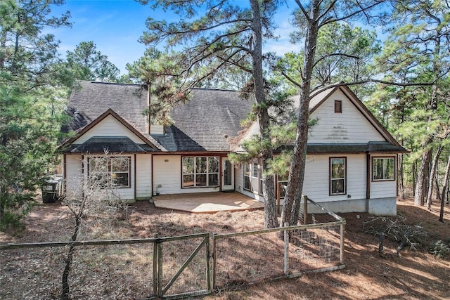 rear view of house with a patio