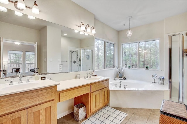 bathroom with vanity, tile patterned floors, and separate shower and tub