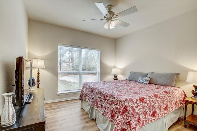 bedroom featuring ceiling fan and light wood-type flooring