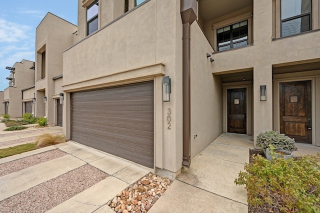 entrance to property featuring a garage