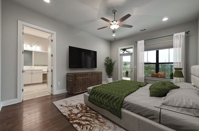 bedroom with ceiling fan, ensuite bathroom, access to exterior, and hardwood / wood-style floors