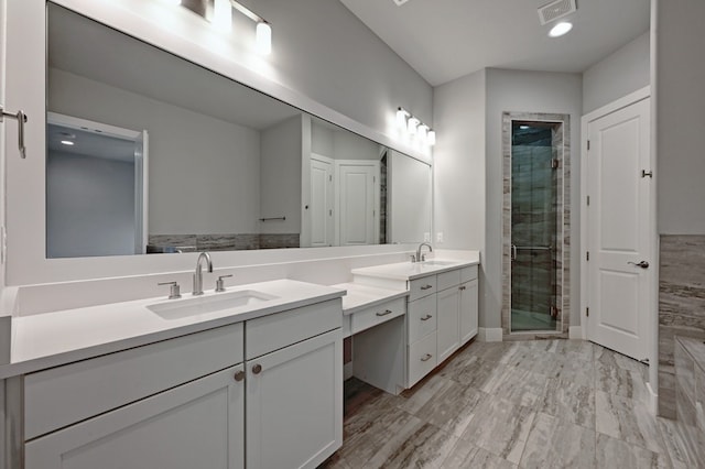 bathroom featuring vanity and walk in shower