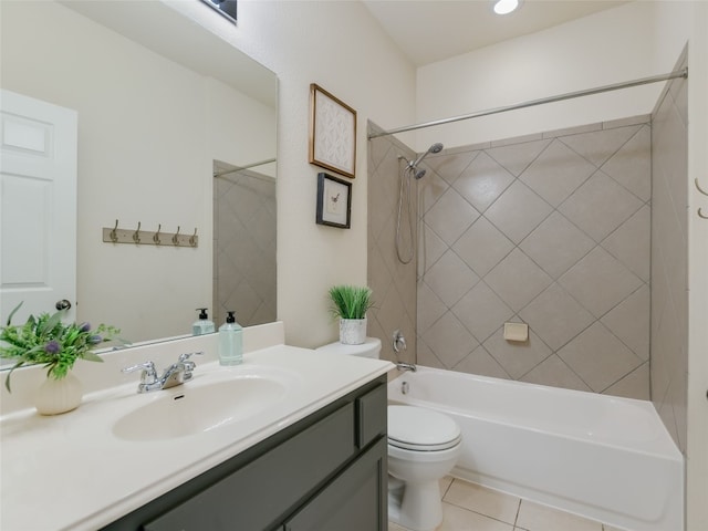 full bathroom with vanity, tiled shower / bath combo, tile patterned floors, and toilet