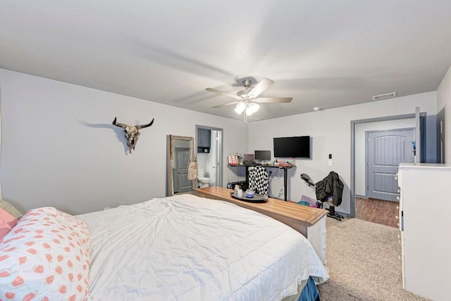 bedroom featuring ceiling fan and connected bathroom