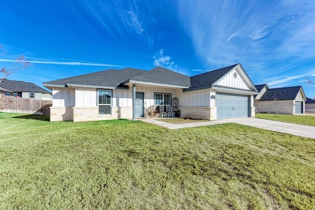 ranch-style home with a garage and a front yard