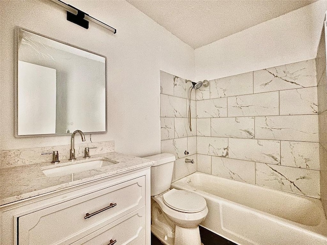 full bathroom featuring vanity, toilet, and tiled shower / bath