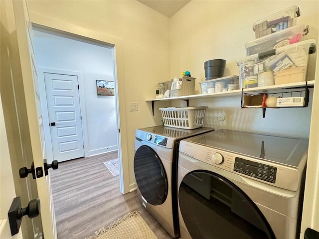 853 Cypress Ln, Cottonwood Shores, TX 78657 - laundry area with washing machine and clothes dryer and baseboards