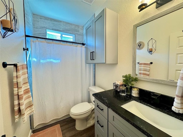 853 Cypress Ln, Cottonwood Shores, TX 78657 - full bath with vanity, toilet, and wood finished floors